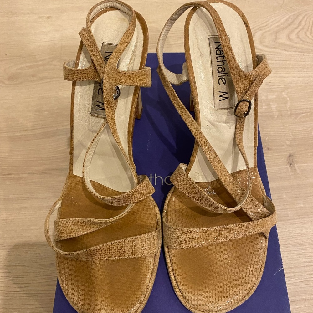 Nude colored, open toe, strap sandal with heels